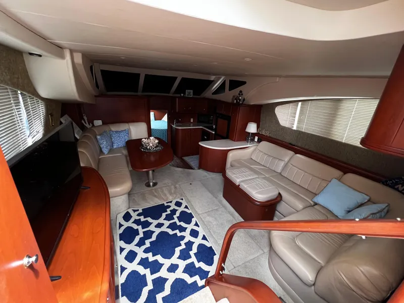 Slide: The Image of Luxurious interior of a 2004 Silverton 39 Motor Yacht with plush seating and modern amenities. - 11