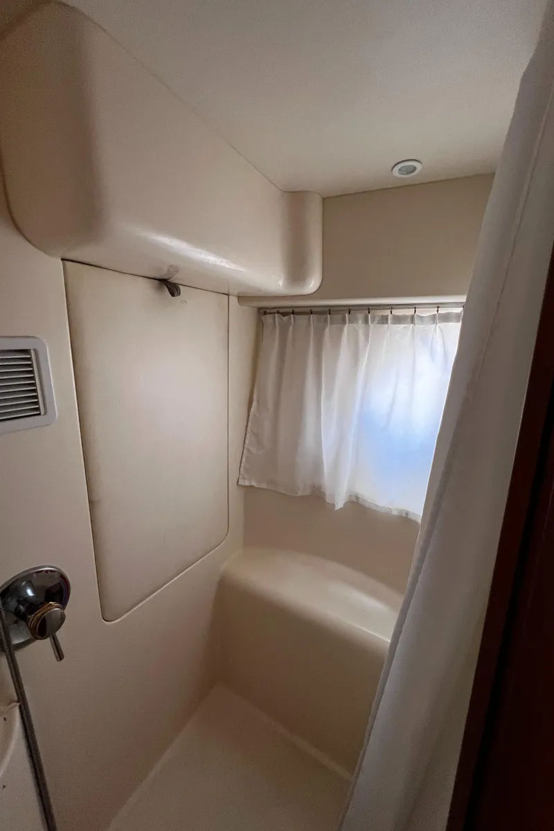 Slide: The Image of Bathroom interior of 2004 Silverton 39 Motor Yacht with shower and curtain. - 24