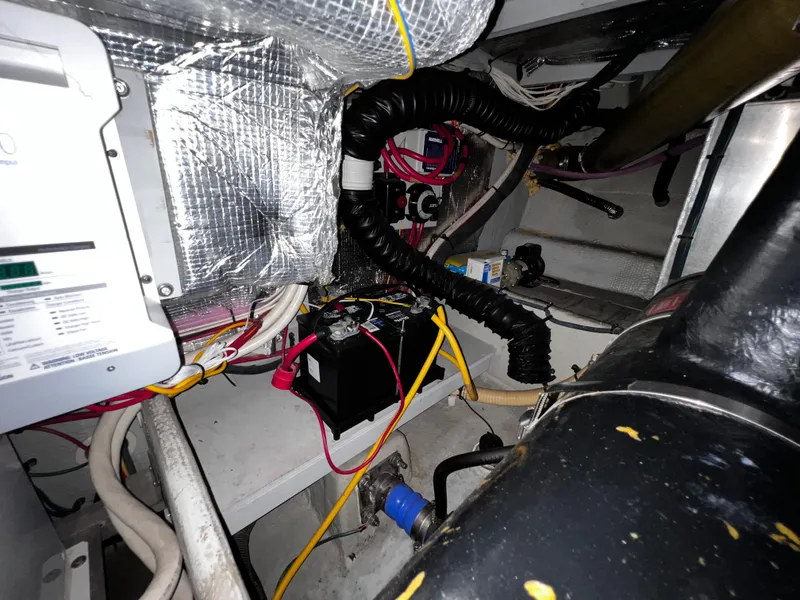 Slide: The Image of Engine room of 2004 Silverton 39 Motor Yacht with wiring and components. - 31