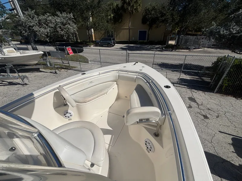 Slide: The Image of 2022 Cobia 237 Center Console boat interior with seating and speakers. - 14