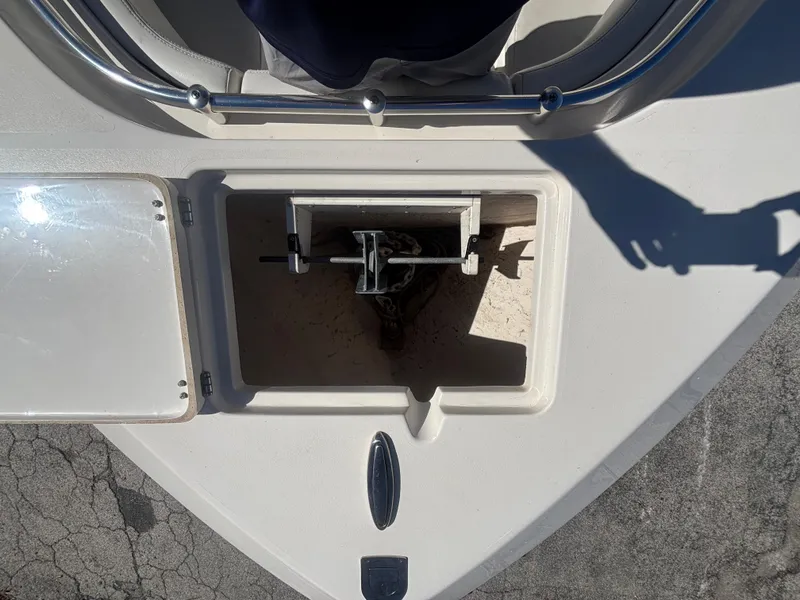 Slide: The Image of Anchor storage compartment on 2022 Cobia 237 Center Console boat. - 16