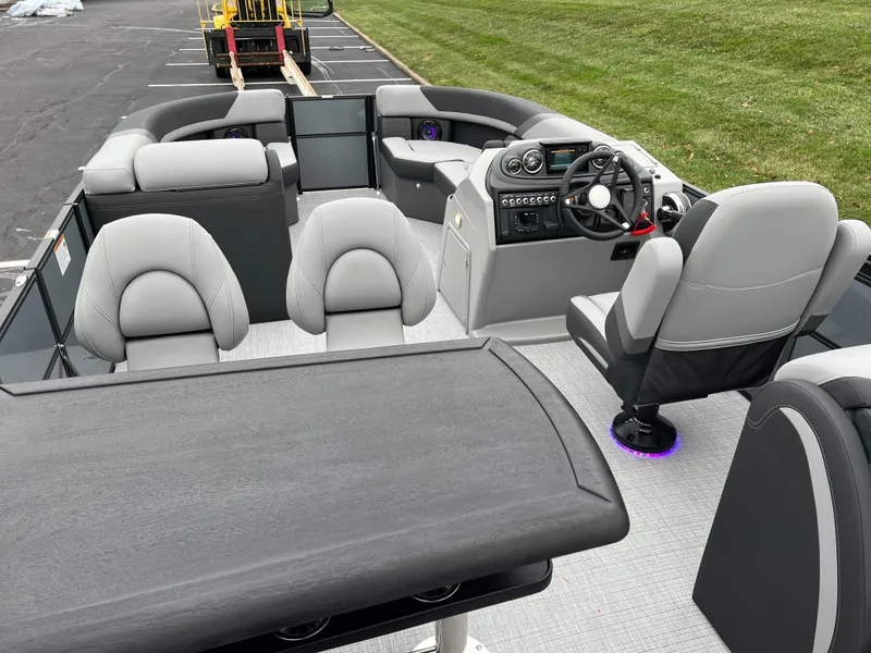 Slide: The Image of 2025 South Bay S224 ENTERTAINER 3.0 pontoon boat interior with modern seating and helm. - 17