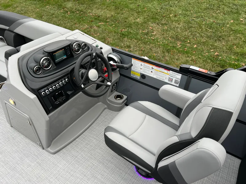 Slide: The Image of 2025 South Bay S224 Entertainer 3.0 boat interior with modern helm and seating. - 18