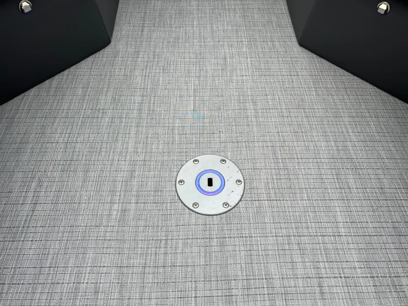 Slide: The Image of 2025 South Bay S224 ENTERTAINER 3.0 boat floor with textured gray surface and circular fixture. - 23