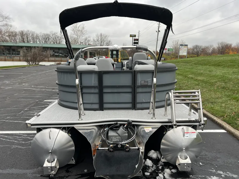 Slide: The Image of 2025 South Bay S224 Entertainer 3.0 pontoon boat, rear view in parking lot. - 5