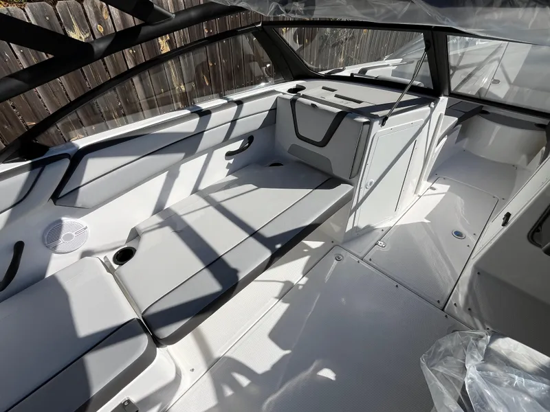 Slide: The Image of 2025 Yamaha Boats AR220 interior with sleek seating and modern design. - 10