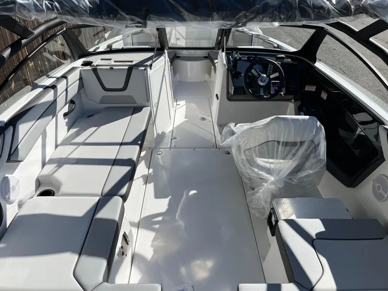 Slide: The Image of 2025 Yamaha AR220 boat interior with sleek seating and modern dashboard. - 9