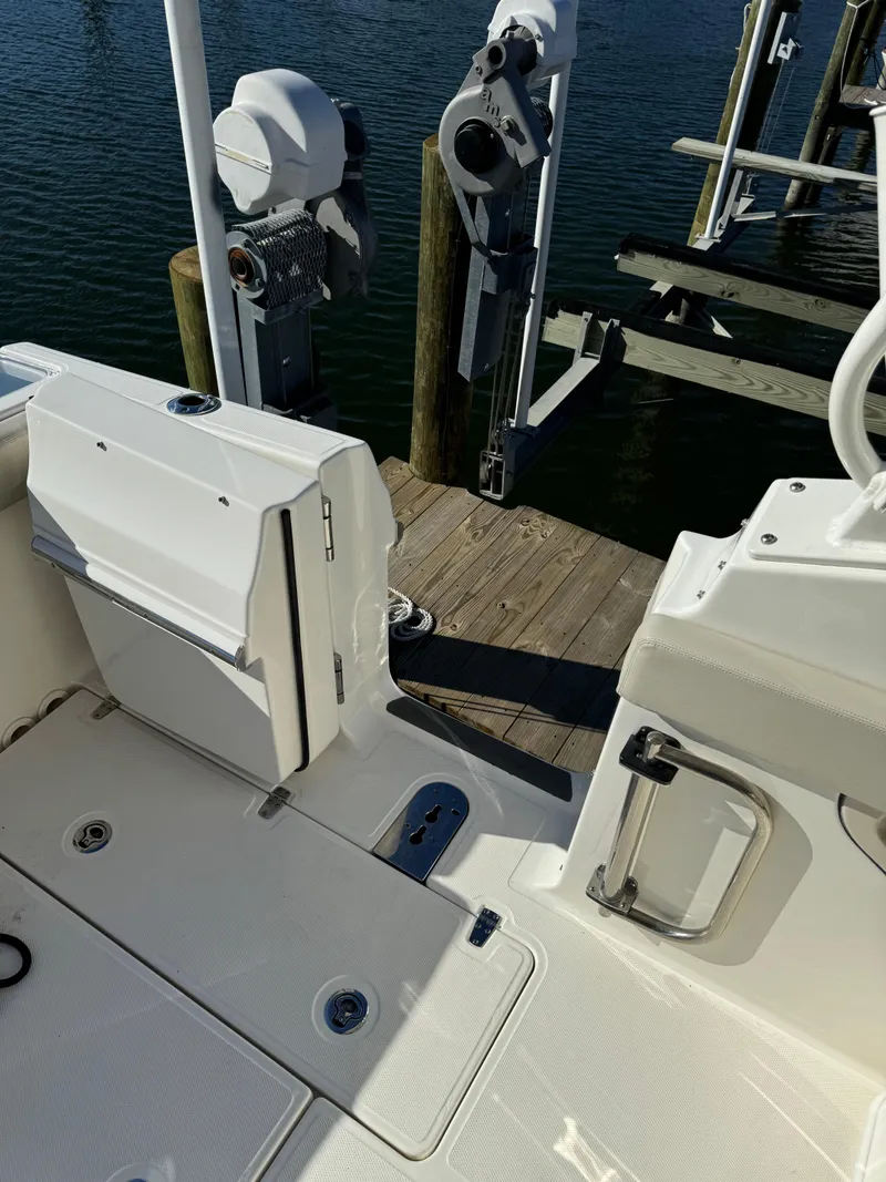 Slide: The Image of 2021 Boston Whaler 280 Vantage boat docked at marina. - 7