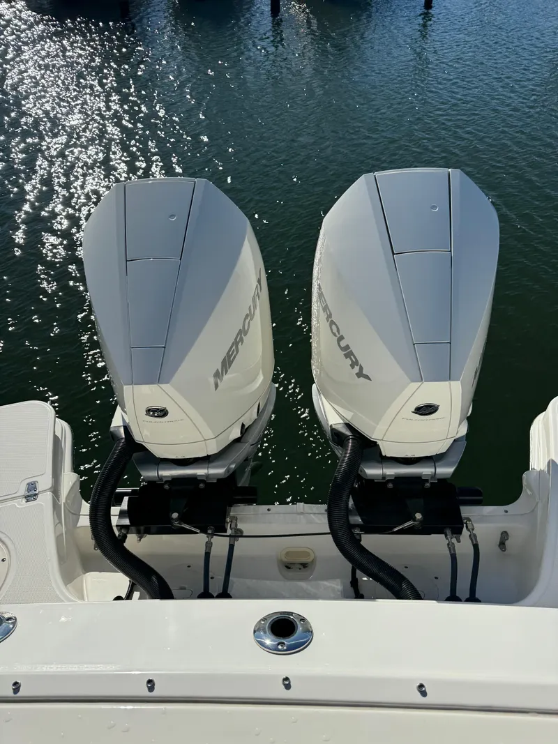 Slide: The Image of 2021 Boston Whaler 280 Vantage with dual Mercury outboard engines on water. - 9