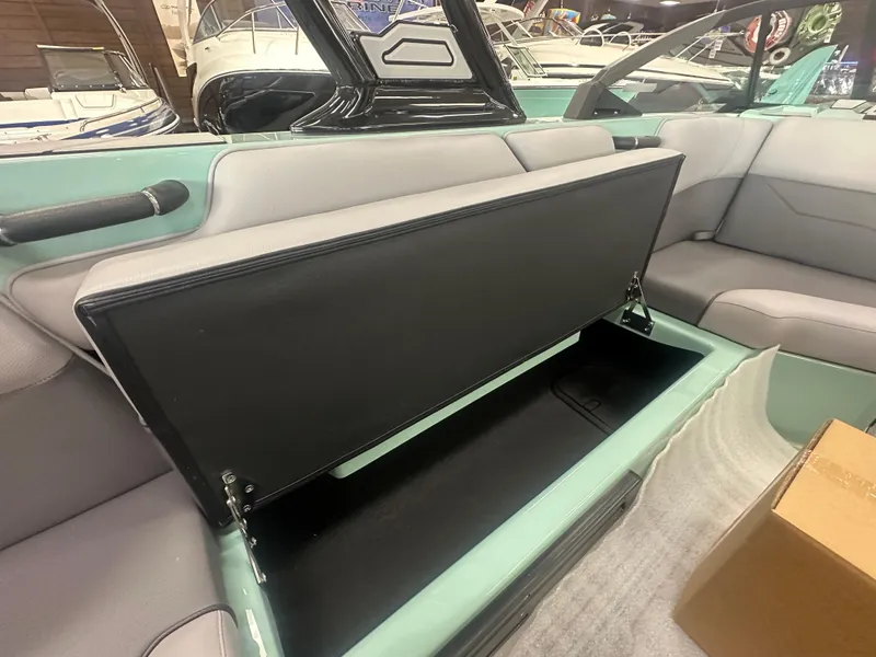 Slide: The Image of 2025 Moomba Max boat interior with open storage compartment. - 17