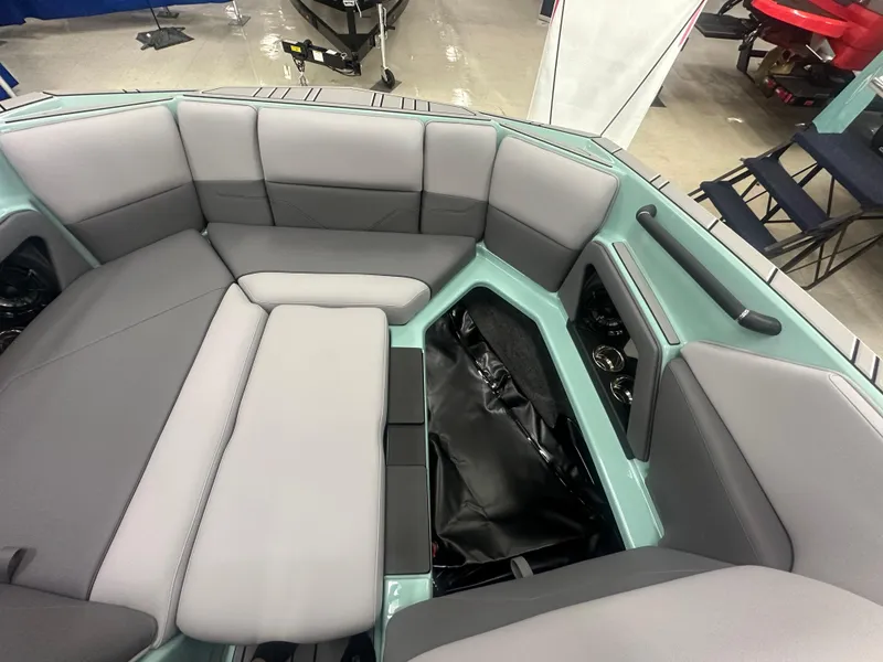 Slide: The Image of 2025 Moomba Max boat interior with spacious seating and storage compartments. - 29