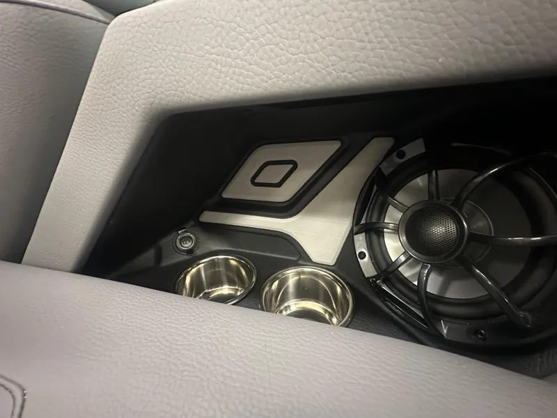 Slide: The Image of 2025 Moomba Max interior speaker and cup holders in a sleek design. - 32