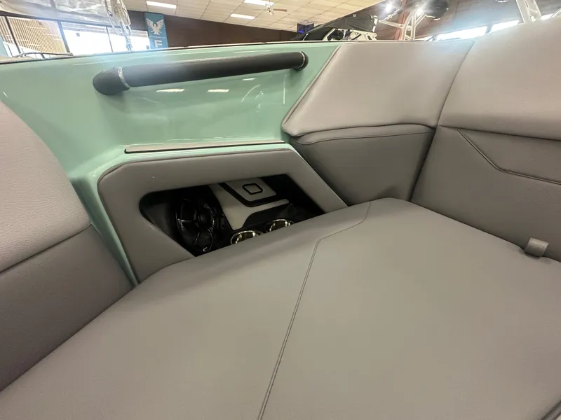 Slide: The Image of 2025 Moomba Max interior seating with teal accents and modern design. - 33