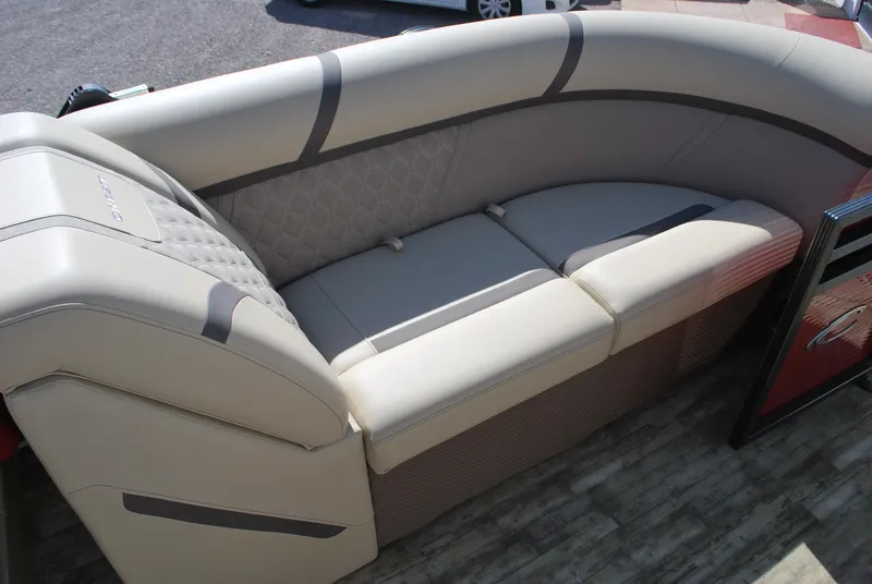 Slide: The Image of 2024 Crest Classic Platinum 240 SLC boat seating, beige upholstery, elegant design. - 14