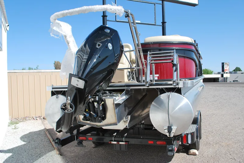 Slide: The Image of 2024 Crest Classic Platinum 240 SLC pontoon boat with powerful outboard motor. - 16