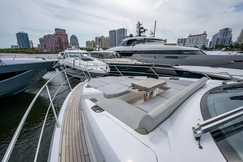 Slide: The Image of Sunseeker Manhattan 68 yacht, 2022 model, docked with city skyline in background. - 12