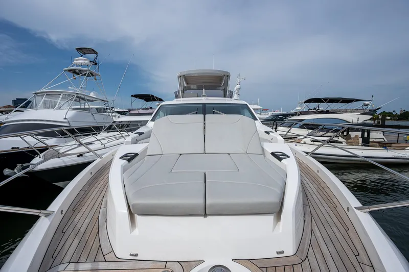 Slide: The Image of Sunseeker Manhattan 68 yacht, 2022 model, docked with sleek design and spacious deck. - 18