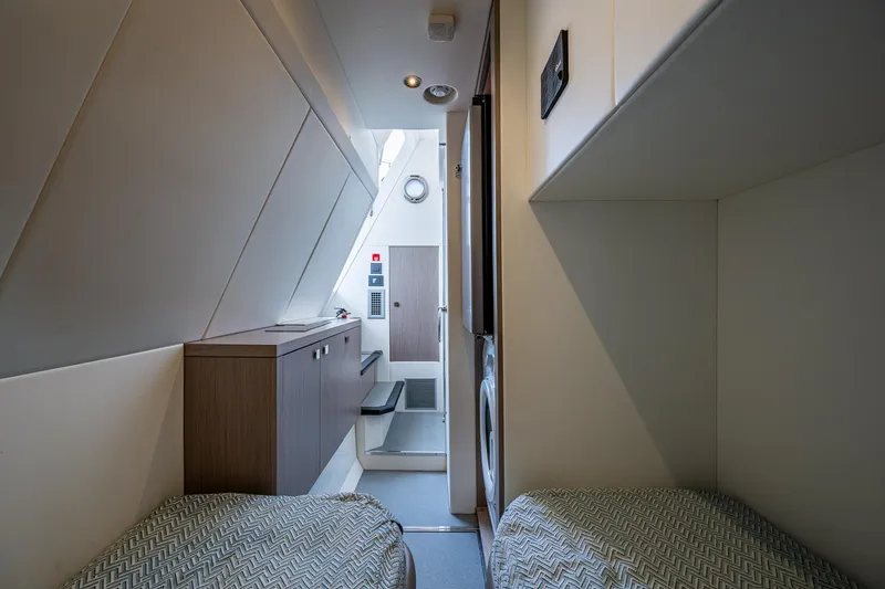 Slide: The Image of Interior of 2022 Sunseeker Manhattan 68 yacht, featuring twin beds and modern design. - 35