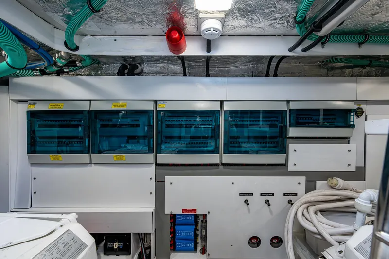 Slide: The Image of Electrical control panel in a 2022 Sunseeker Manhattan 68 yacht engine room. - 42