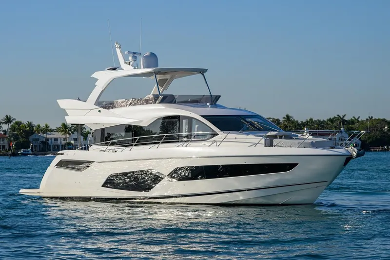 Slide: The Image of 2022 Sunseeker Manhattan 68 yacht cruising on a sunny day. - 5