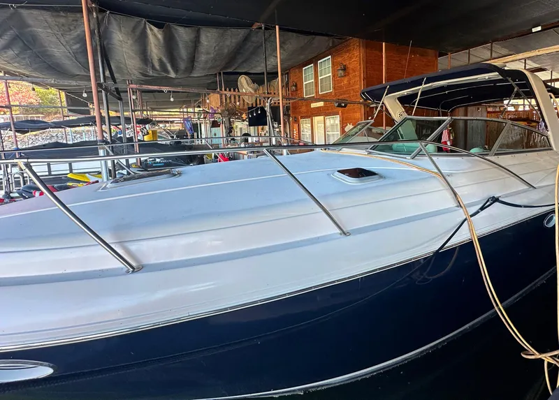 Slide: The Image of 2003 Rinker Fiesta Vee 312 boat docked in marina. - 1