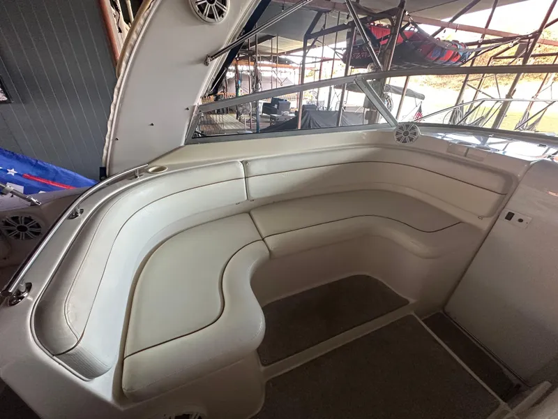 Slide: The Image of 2003 Rinker Fiesta Vee 312 boat interior with white seating and modern design. - 11