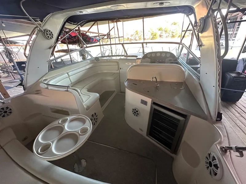 Slide: The Image of 2003 Rinker Fiesta Vee 312 boat interior with seating and helm. - 12