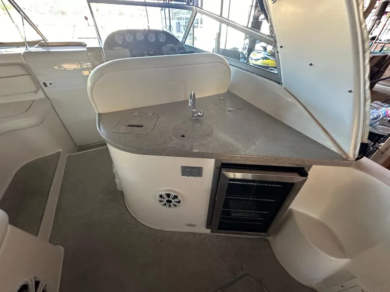 Slide: The Image of 2003 Rinker Fiesta Vee 312 boat interior with kitchenette and sink. - 14