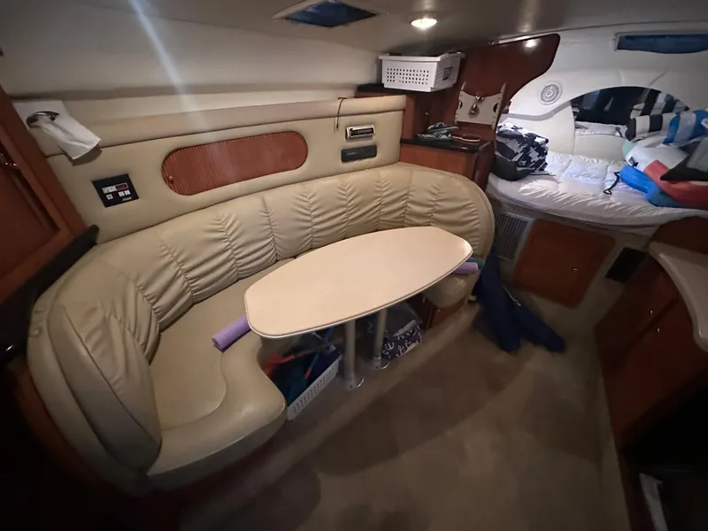 Slide: The Image of Interior of 2003 Rinker Fiesta Vee 312 boat with cozy seating and table. - 17