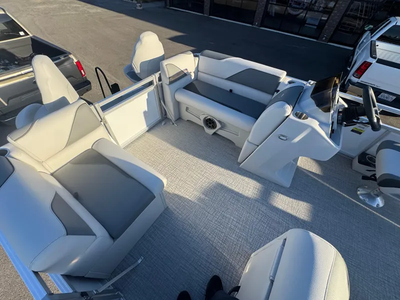 Slide: The Image of 2025 Tahoe Pontoon SP 2180 FNC interior with modern seating and steering console. - 10