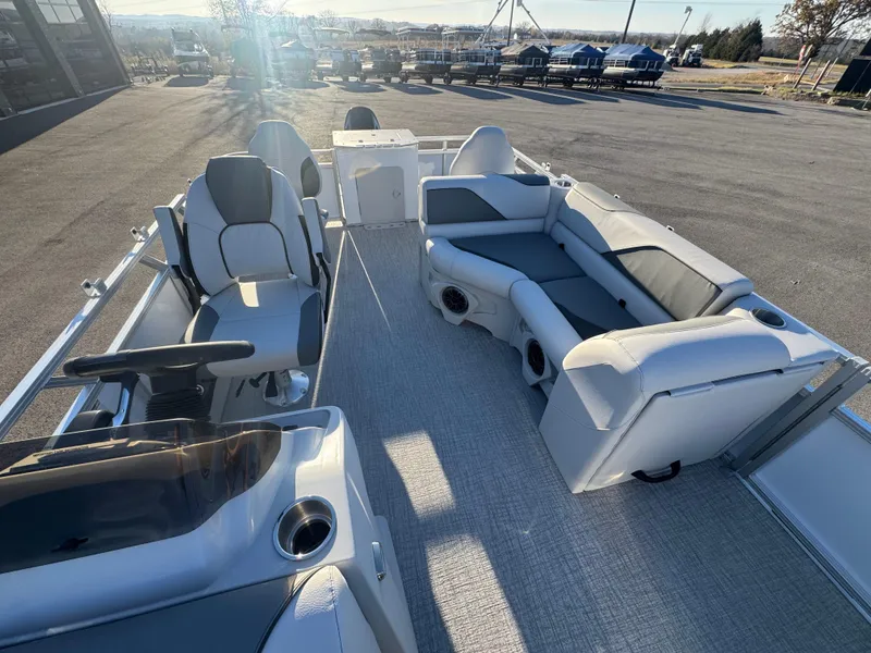 Slide: The Image of 2025 Tahoe Pontoon SP 2180 FNC interior with seating and steering console. - 4