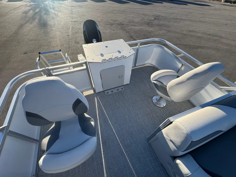 Slide: The Image of 2025 Tahoe Pontoon SP 2180 FNC interior with seating and helm station. - 5