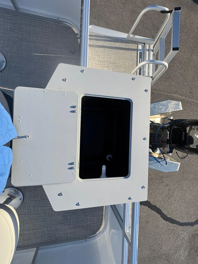 Slide: The Image of 2025 Tahoe Pontoon SP 2180 FNC deck with storage compartment and seating. - 6