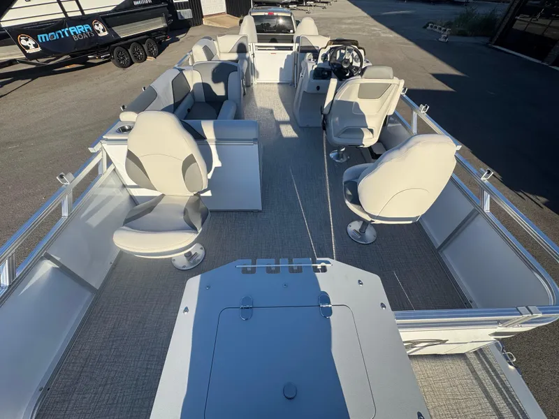 Slide: The Image of 2025 Tahoe Pontoon SP 2180 FNC boat interior with seating and steering console. - 7