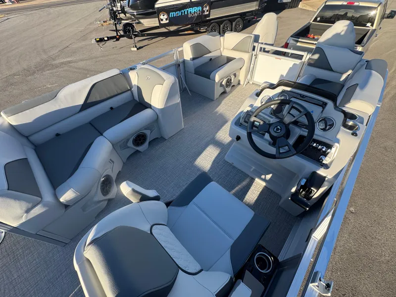 Slide: The Image of 2025 Tahoe Pontoon SP 2180 FNC interior with modern seating and steering console. - 8