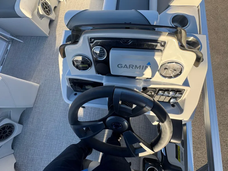 Slide: The Image of 2025 Tahoe Pontoon SP 2180 FNC dashboard with Garmin navigation system. - 9
