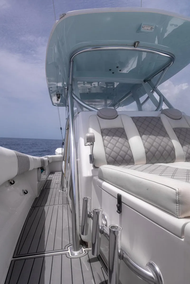 Slide: The Image of 2021 Front Runner 39 Center Console boat with sleek seating and ocean backdrop. - 10