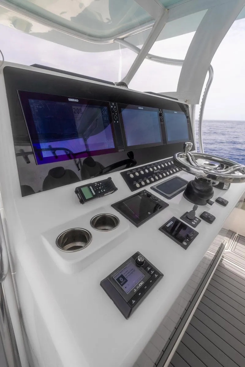 Slide: The Image of 2021 Front Runner 39 Center Console boat dashboard with advanced navigation systems. - 11
