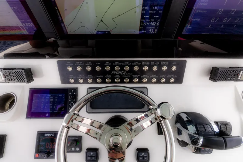 Slide: The Image of 2021 Front Runner 39 Center Console dashboard with advanced navigation and control systems. - 12