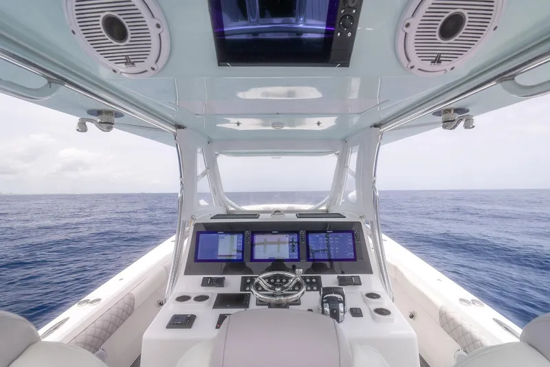 Slide: The Image of 2021 Front Runner 39 Center Console boat interior with advanced navigation system. - 16