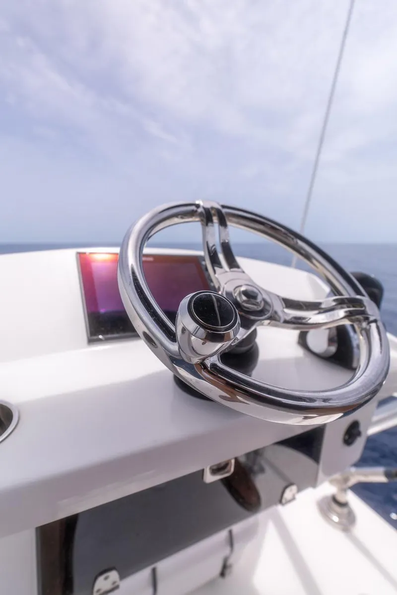 Slide: The Image of 2021 Front Runner 39 Center Console steering wheel on open sea. - 18