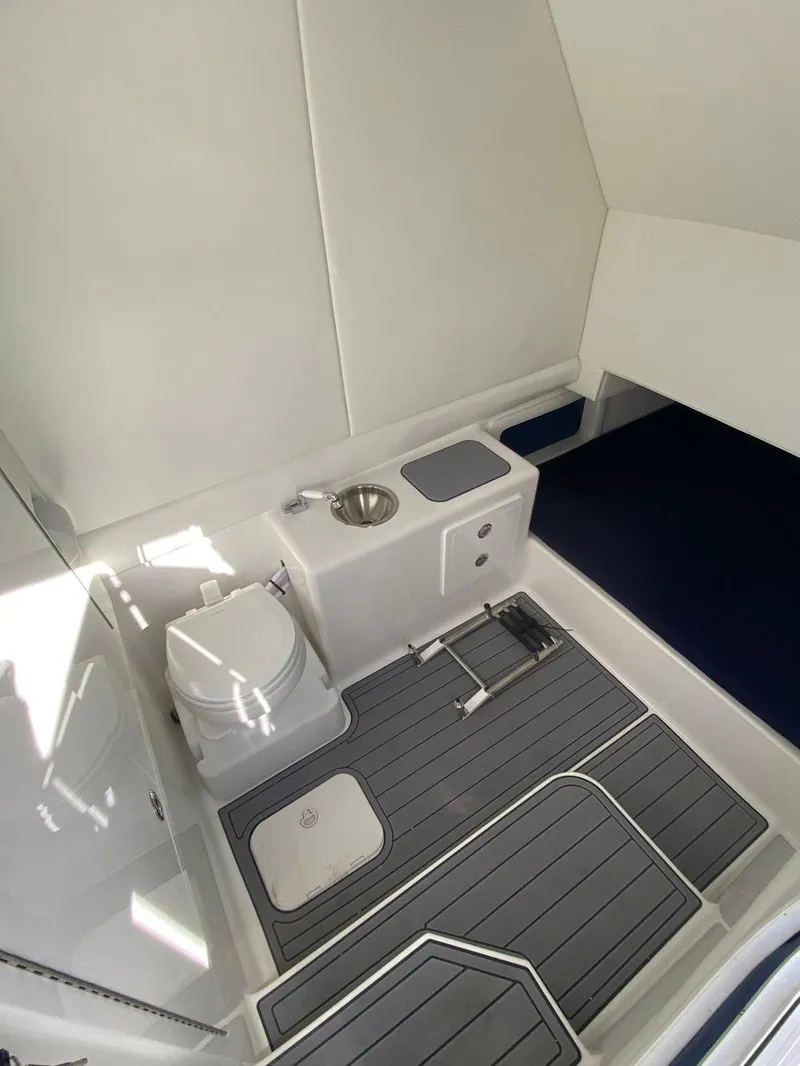 Slide: The Image of 2021 Front Runner 39 Center Console interior with toilet and sink. - 20