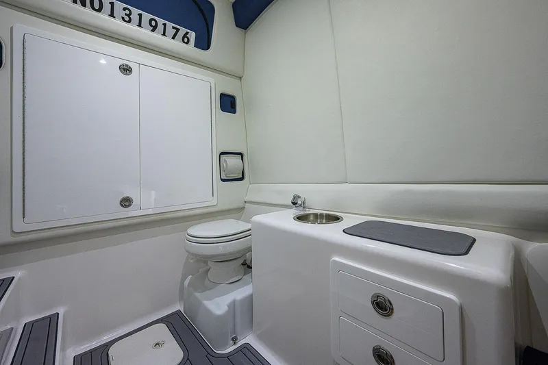 Slide: The Image of 2021 Front Runner 39 Center Console boat interior with toilet and sink. - 22