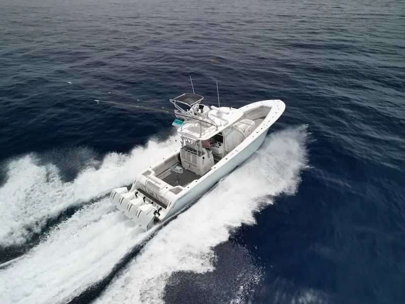Slide: The Image of 2021 Front Runner 39 Center Console boat cruising on open ocean waters. - 23