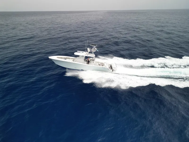 Slide: The Image of 2021 Front Runner 39 Center Console boat cruising on open ocean waters. - 24