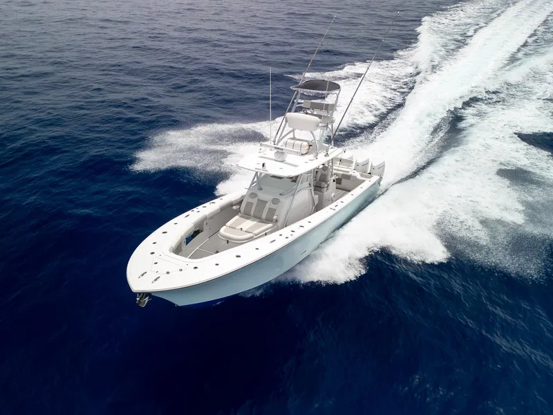 Slide: The Image of 2021 Front Runner 39 Center Console boat cruising on open ocean waters. - 25