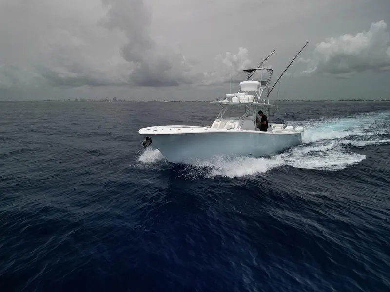 Slide: The Image of 2021 Front Runner 39 Center Console boat cruising on open ocean. - 33