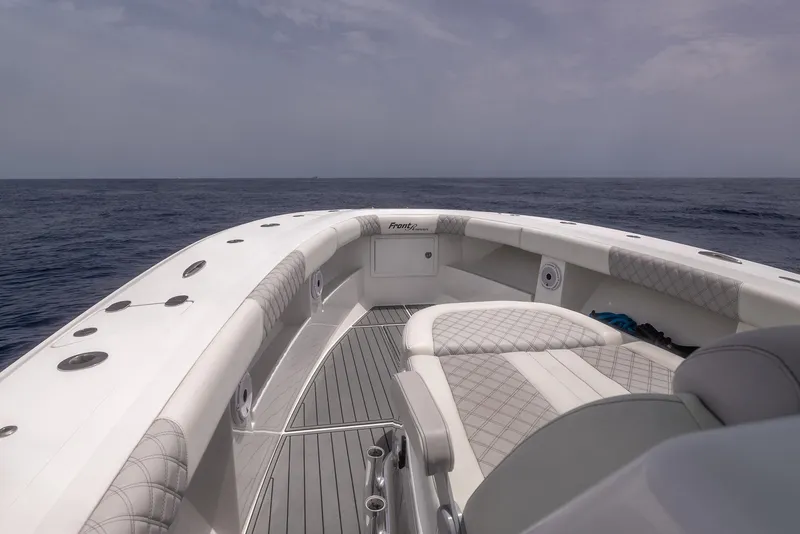 Slide: The Image of 2021 Front Runner 39 Center Console boat on open sea, featuring spacious deck and seating. - 9