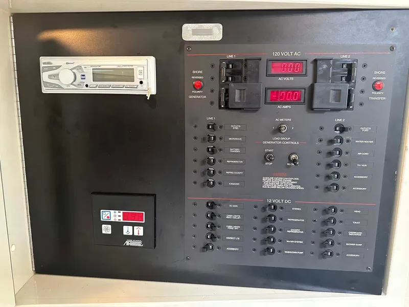 Slide: The Image of Electrical control panel of 1999 Wellcraft 45 Excalibur boat with stereo system. - 16