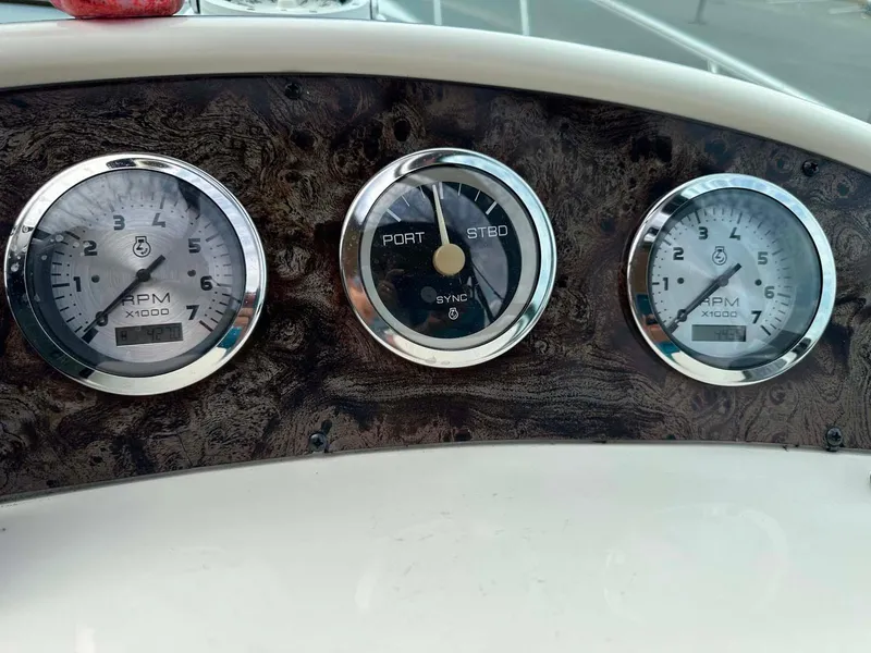 Slide: The Image of Dashboard of 1999 Wellcraft 45 Excalibur with RPM and steering gauges. - 18